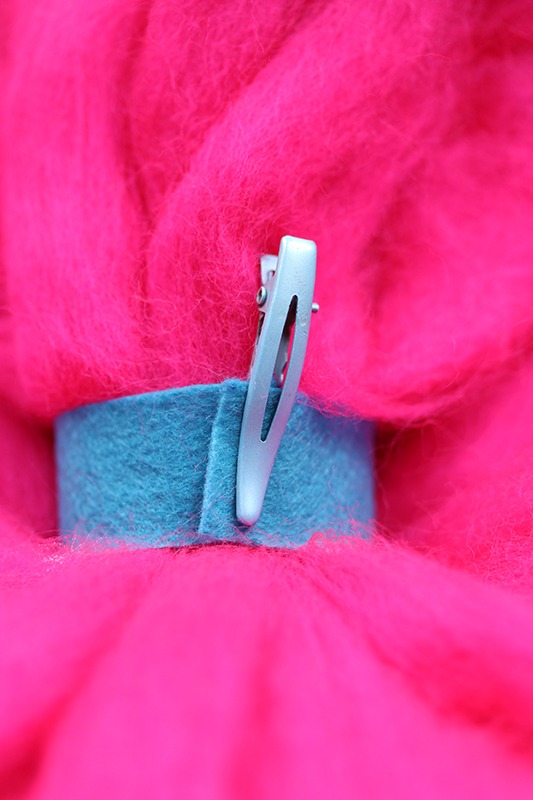 Princess Poppy costume: tying the ponytail